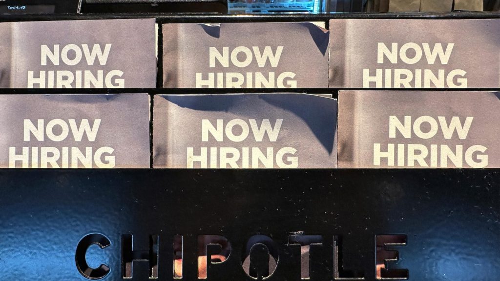 US applications for jobless benefits fall to 213,000, remaining near 7-month lows